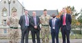 Scottish Veterans Minister, Graeme Dey, with current and former soldiers outside barracks in Edinburgh