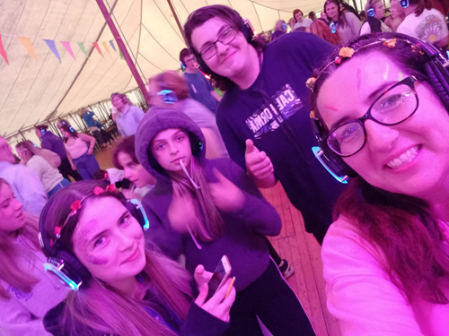 A group young carers enjoying a silent disco