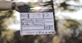 Close-up of clapperboard on film set