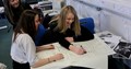 Female pupils at Currie Community High School working together on a project